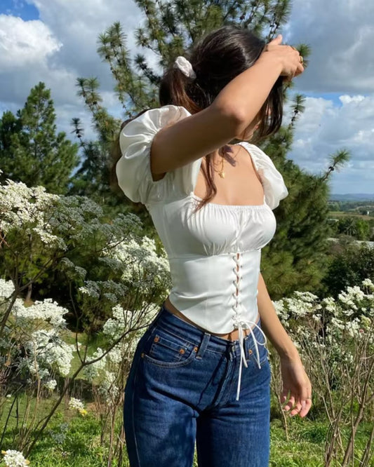 topwear,tops,casual, vacation, outdoor events,minimal, soft girl, summer,woven,satin,white,solid,criss cross detail, ruched,drawstring,slim fit,fitted,waist length,curved hem,square neck,puff sleeves,short sleeves	25050014GG, OY1022
