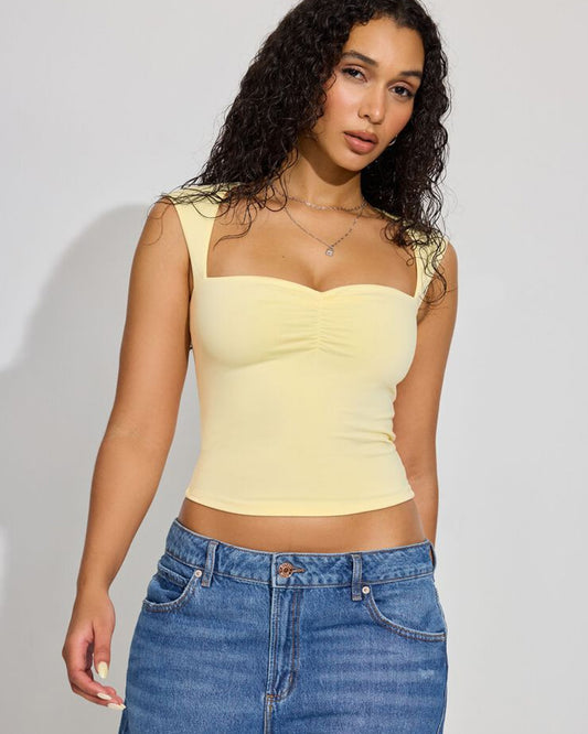 topwear,tops,casual,streetwear,knitted,single jersey,yellow,solid,slim fit,crop,crop,sweetheart neck,cap sleeves	24060027AB, OY647