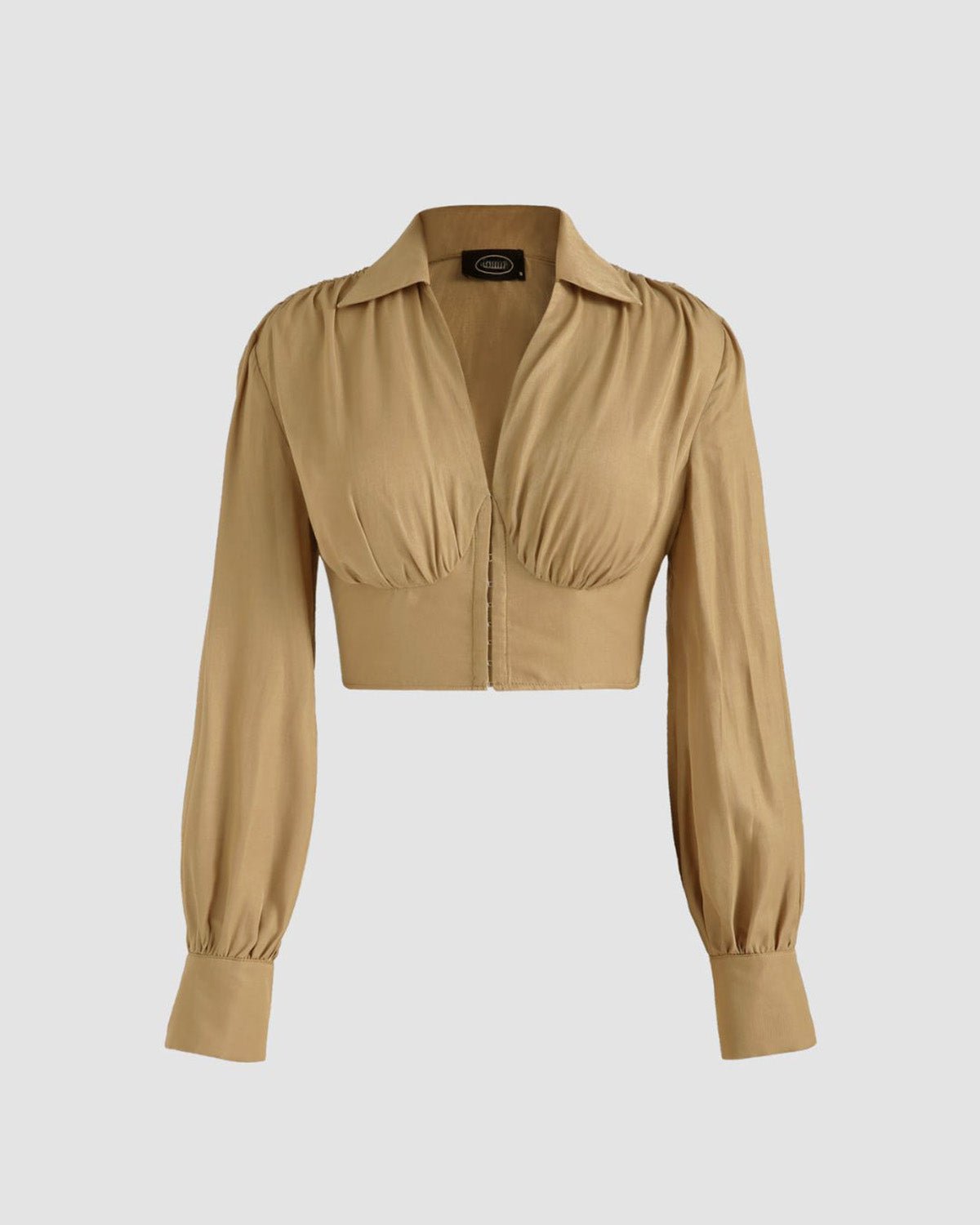collared-corset-top-beige,COLLARED CORSET TOP,Color: Beige Fabric: Rayon Type: Corset  Fit: Slim Fit  Length: Crop Sleeve: Long Sleeve Neck: Collared Neck Closure: Hook & Eye Print: Solid,topwear,tops,casual, vacation,summer, streetwear,woven,rayon,beige,solid,gathered,slim fit,corset,crop,collared,long sleeves