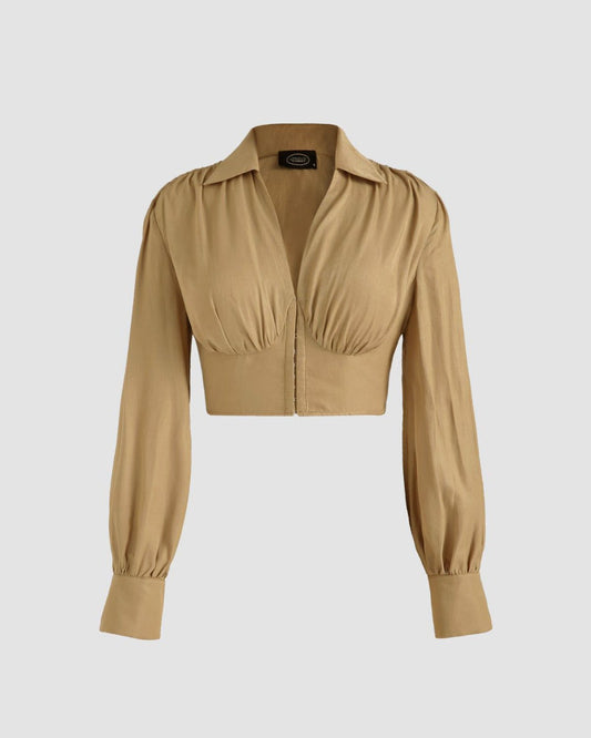 collared-corset-top-beige,COLLARED CORSET TOP,Color: Beige Fabric: Rayon Type: Corset  Fit: Slim Fit  Length: Crop Sleeve: Long Sleeve Neck: Collared Neck Closure: Hook & Eye Print: Solid,topwear,tops,casual, vacation,summer, streetwear,woven,rayon,beige,solid,gathered,slim fit,corset,crop,collared,long sleeves
