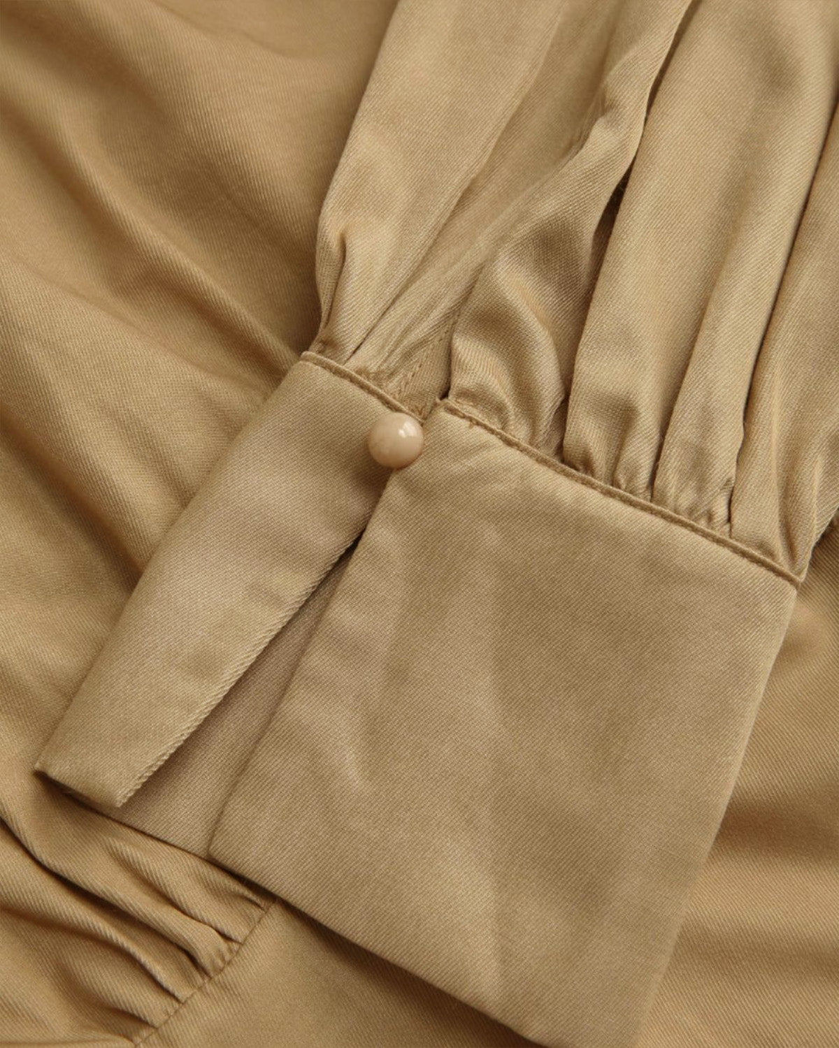 collared-corset-top-beige,COLLARED CORSET TOP,Color: Beige Fabric: Rayon Type: Corset  Fit: Slim Fit  Length: Crop Sleeve: Long Sleeve Neck: Collared Neck Closure: Hook & Eye Print: Solid,topwear,tops,casual, vacation,summer, streetwear,woven,rayon,beige,solid,gathered,slim fit,corset,crop,collared,long sleeves