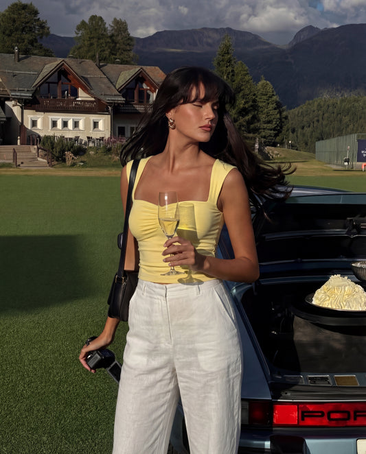 Butter yellow, topwear,tops,casual,summerwear, streetwear, knitted,single jersey,yellow,solid,slim fit,crop,crop,sweetheart neck,cap sleeves	24060027AB, OY647