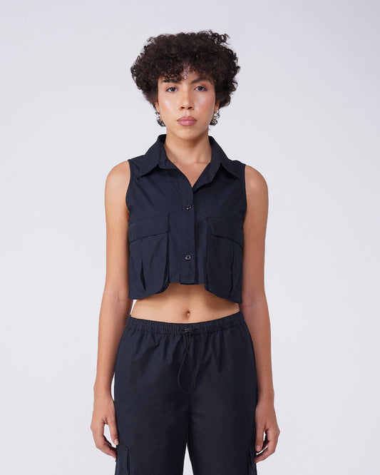 flap-pocket-co-ord-crop-shirt-black,FLAP POCKET CO-ORD CROP SHIRT,Color: BlackFabric: Cotton, PoplinFit: Regular Fit Length: CropNeck: CollaredSleeves: SleevelessClosure: Button-UpPrint: SolidDetails: Flap-Pocket,coord sets,tops,casual,streetwear,woven,cotton, poplin,black,solid,flap pocket, utility pocket,regular fit,crop,crop,collared,sleeveless,Manufacturing batch1_June19