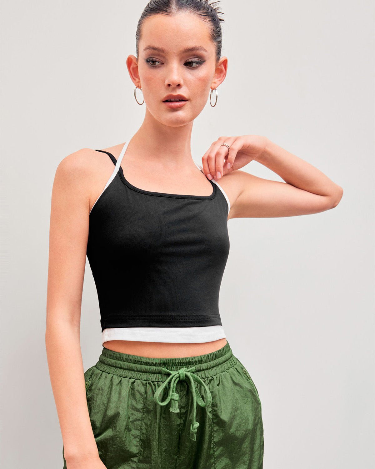 halter-neck-crop-top-black,HALTER NECK CROP TOP,topwear,tops,casual,streetwear,knitted, stretchable,single jersey,black,solid,contrast,skinny fit,crop,crop,halter neck,spaghetti strap,sleeveless