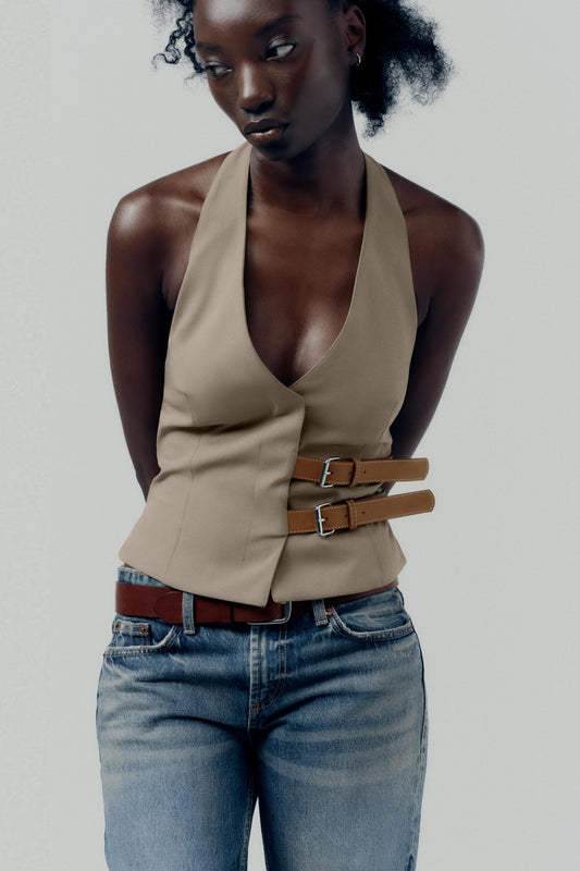 topwear,tops,semi formal, outdoor events,creative workwear, minimal, sophisticated,stretchable,polyester, spandex,beige,solid,contrast,buckle, button, belt,tailored fit,fitted,waist length,v-neck,sleeveless	OY1711,25010066GG