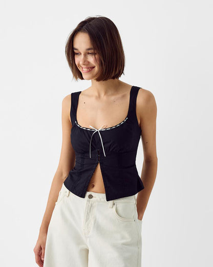 pinktuck-detail-slit-top-black,topwear,tops,casual,streetwear,woven,Stretchable,poplin,black,solid,ruched,regular fit,slit,regular,slit,square neck,shoulder strap,sleeveless,Color: Black
Fabric: Poplin
Fit: Skinny Fit 
Length: Regular
Neck: Square Neck
Closure: Hook & Eye
Print: Solid
Details: Pintuck seam detailing adds texture and structure. The contrast bow tie at the center adds a feminine touch.,PINKTUCK DETAIL SLIT TOP