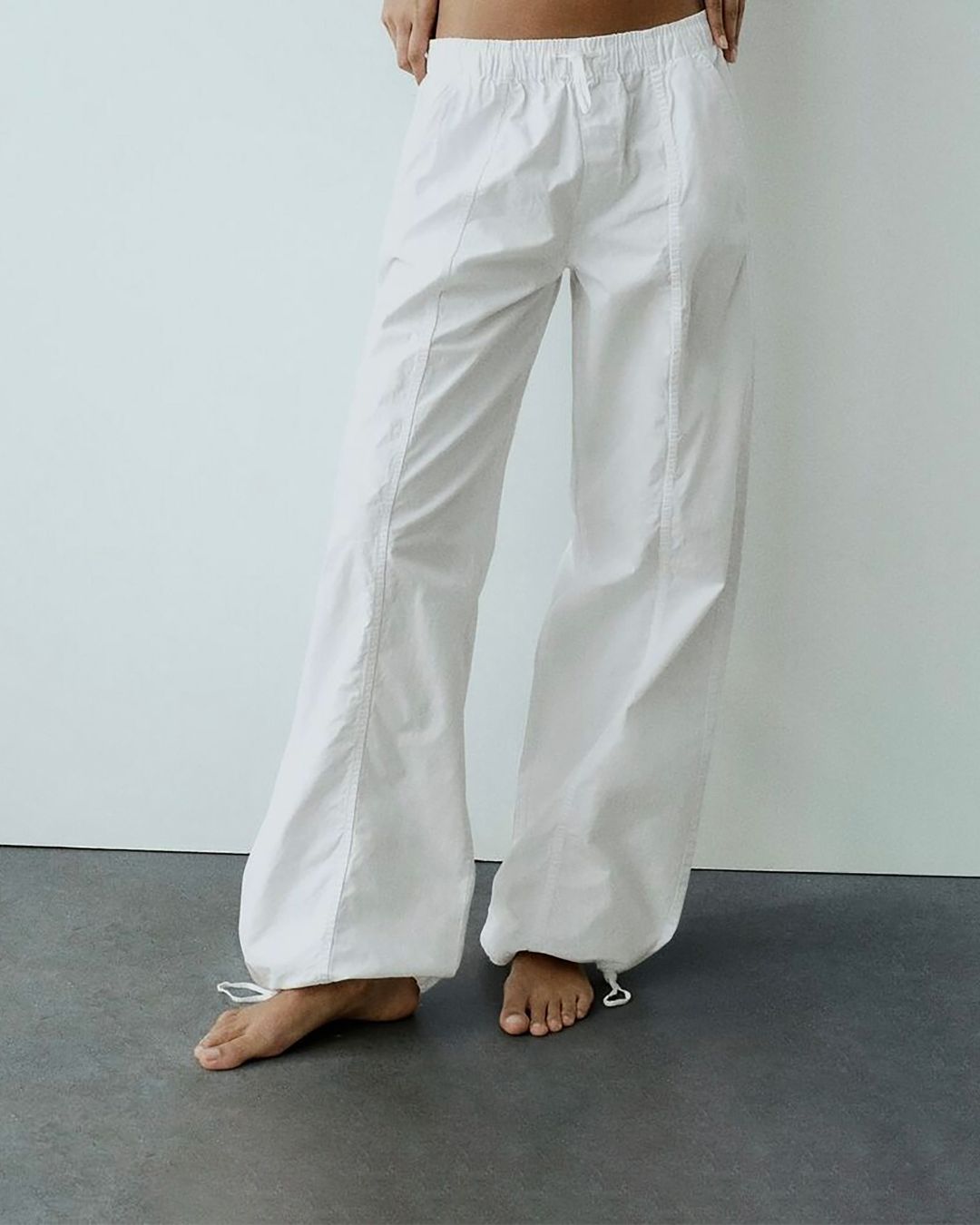PARACHUTE PANTS,baggy fit, bottomwear, casual, cotton, drawstring, full length, mid rise, parachutes, streetwear, white, woven,parachute-pants-white,Color- White
Fabric- Cotton
Fit- Baggy Fit 
Length- Full Length (41in)
Waist- High Rise
Hem- Drawstring Hem
Closure- Elasticated Waist
No. of Pockets- 2
Print- Solid