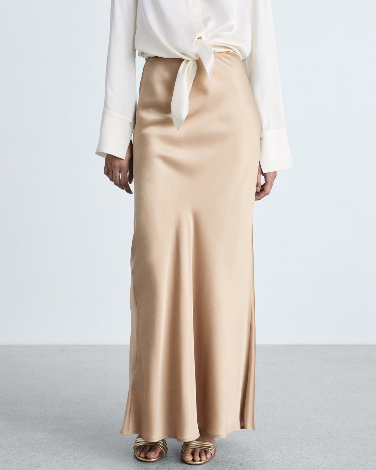 bottomwear,skirts,casual chic, outdoor events, party,glam, summer, urban fit, vintage,woven,satin,beige,zipper,skinny fit,a-line skirt,maxi,a-line,mid rise	25070011GG, OY2084