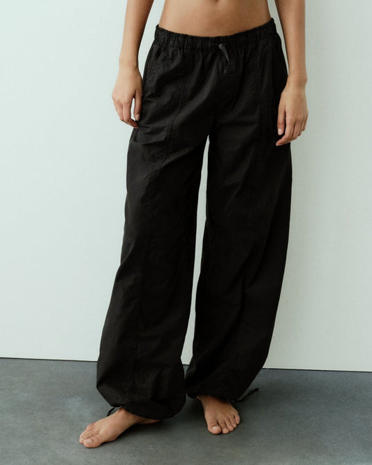 PARACHUTE PANTS,baggy fit, black, bottomwear, casual, cotton, drawstring, full length, mid rise, parachutes, streetwear, woven,parachute-pants-black,Color- Black
Fabric- Cotton
Fit- Baggy Fit 
Length- Full Length (41in)
Waist- High Rise
Hem- Drawstring Hem
Closure- Elasticated Waist
No. of Pockets- 2
Print- Solid