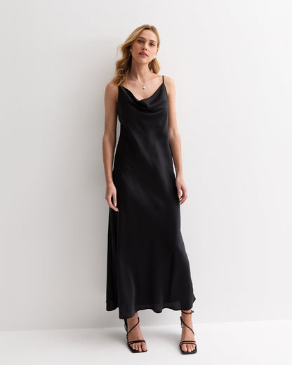 dresses,dresses,date night, party, statement, vacation,bold, glam, summer,woven,satin,black,solid,regular fit,slip,maxi,cami neck,spaghetti strap,sleeveless,Color: Black
Fabric: Satin
Type: Slip Dress
Fit: Relaxed Fit
Length: Maxi
Neck: Cami Neck
Strap: Spaghetti Strap
Print: Solid,SATIN MAXI SLIP DRESS IN BLACK,satin-maxi-slip-dress-in-black-black-oy1214