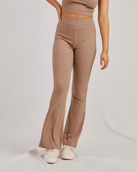 RIBBED FLARED TROUSER,Color: Nude
Fabric: Ribbed
Fit: Flared Fit 
Length: Full Length (43 inches)
Waist: High Rise
Print: Solid
Details: Ribbed Surface,bottomwear,trousers,casual,knitted,ribbed,nude,flared fit,flared,full length,flared,high rise,suited for influencer,ribbed-flared-trouser-nude