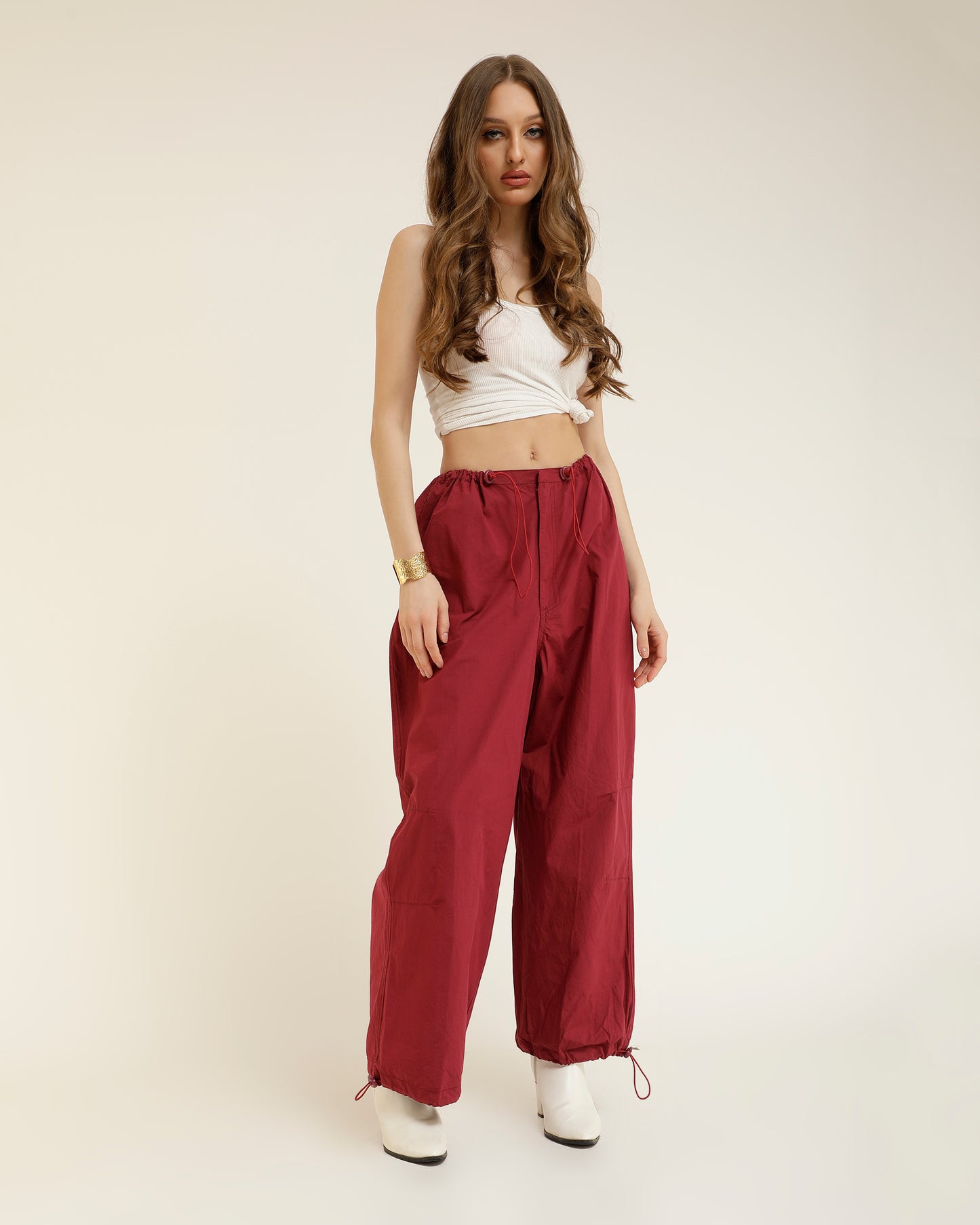 ADJUSTABLE SLIDER PARACHUTE PANTS,adjustable strap, adjustable waist, bottomwear, cotton, drawstring, full length, high rise, high waist, maroon, new drop april 24, pants, parachutes, trousers,parachute-adjustable-slider-trouser,Length - Full length Waist - High-rise waist Fit - Regular fit Color - MaroonNo. of Pockets - 2Material - Cotton Length - 40"Closure - Zip &amp; hook Detail - Adjustable sliders