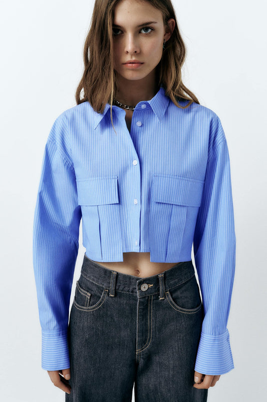 PINSTRIPE CROP SHIRT,blue, button, casual, collared, cotton, crop, long sleeves, oversized, patch pocket, pinstripe, printed, shirts, streetwear, stripes, topwear, utility pocket, woven,crop-relaxed-fit-stripes-blue-shirt,Neck - Shirt collar 
 Sleeve - Long sleeves
 Fit - Relaxed fit
 Print/Pattern - Stripes
 Color - Blue and white
 Material - Poly cotton 
 Detail - Front flap patch pockets