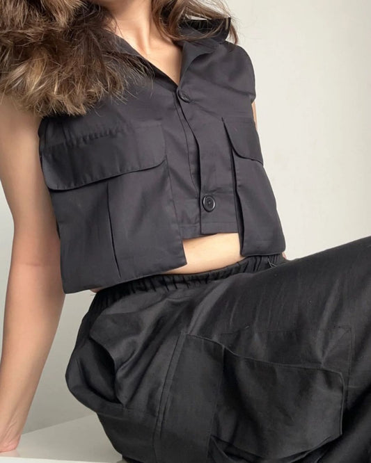 flap-pocket-co-ord-crop-shirt-black,FLAP POCKET CO-ORD CROP SHIRT,Color: Black
Fabric: Cotton, Poplin
Fit: Regular Fit 
Length: Crop
Neck: Collared
Sleeves: Sleeveless
Closure: Button-Up
Print: Solid
Details: Flap-Pocket,coord sets,tops,casual,streetwear,woven,cotton, poplin,black,solid,flap pocket, utility pocket,regular fit,crop,crop,collared,sleeveless,Manufacturing batch1_June19