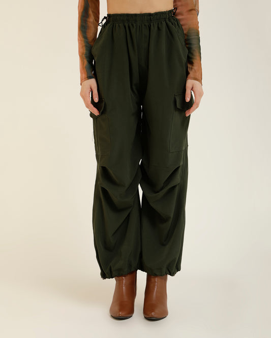 SIDE ADJUSTERS PARACHUTE PANTS,adjustable waist, bottomwear, drawstring, flap pocket, full length, green, parachutes, polyester, relaxed fit, streetwear, summer, vacation, woven,side-adjusters-parachute-pants-green,Color- Green
Fabric- Polyester
Fit- Relaxed Fit 
Length- Full Length
Waist- Adjustable Waist
Hem- Drawstring
Closure- Drawstring
No. of Pockets- 4
Print- Solid
Details- Multi Pockets &amp; Drawstring Adjusters