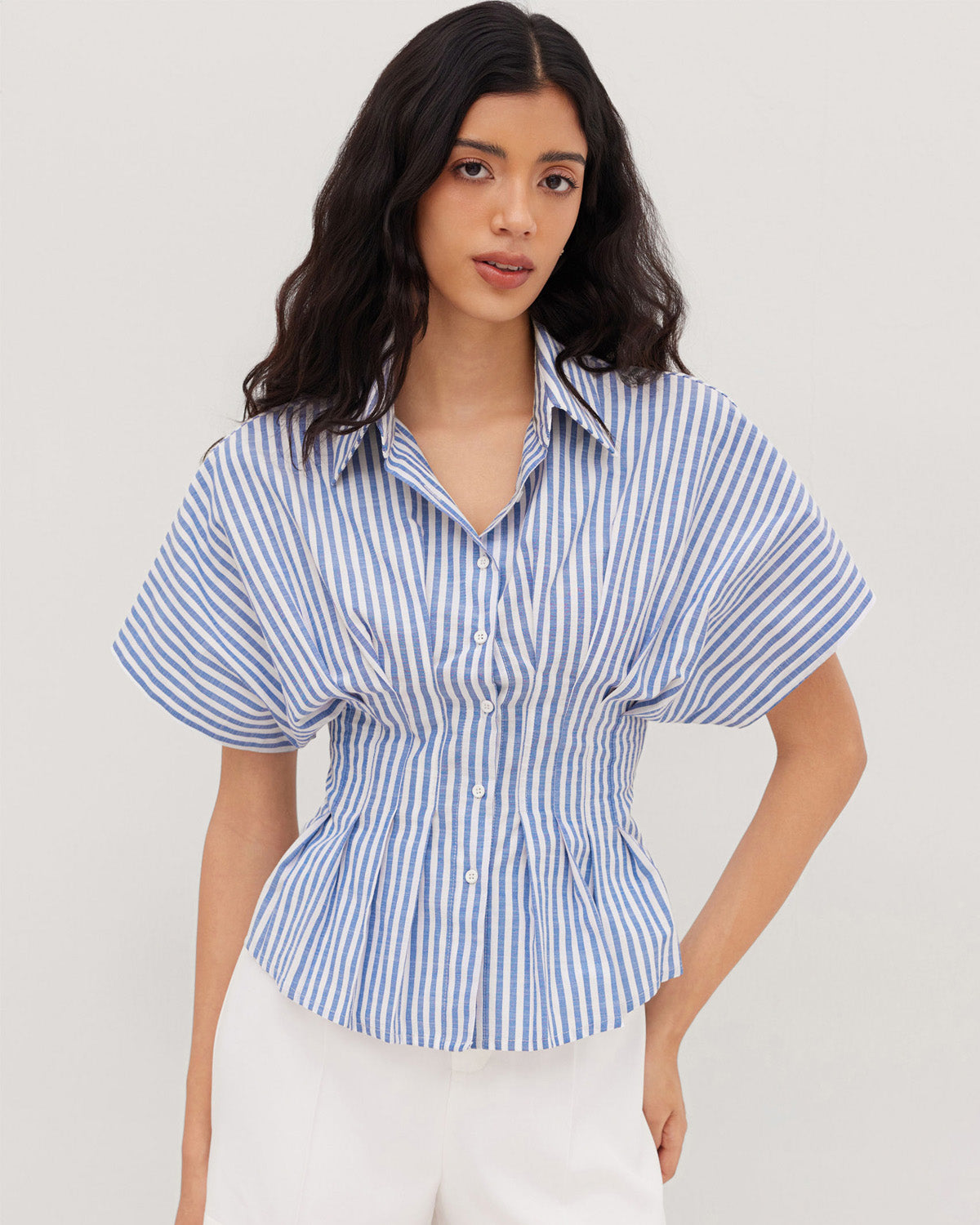 topwear,tops,casual, outdoor events,minimal, summer, streetwear,woven,linen,printed,blue,color block, pinstripes,pleated, pinstripes,button,tailored fit,fit and flare,waist length,curved hem,shirt collar,batwing sleeve,short sleeves	25060048GG,OY2016