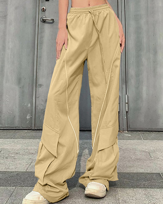 PANELLED BAGGY FIT TROUSER,Color: Beige
Fabric: Poplin
Length: Full length 
Fit: Baggy Fit
Waist: High Rise 
Closure: Elasticated
No. of Pockets: 2
Print: Solid
Detail: Panel with piping detail and a pocket at the hem.,cargos,bottomwear,cargos,casual,streetwear,woven,poplin,beige,baggy fit,cargo,full length,high rise