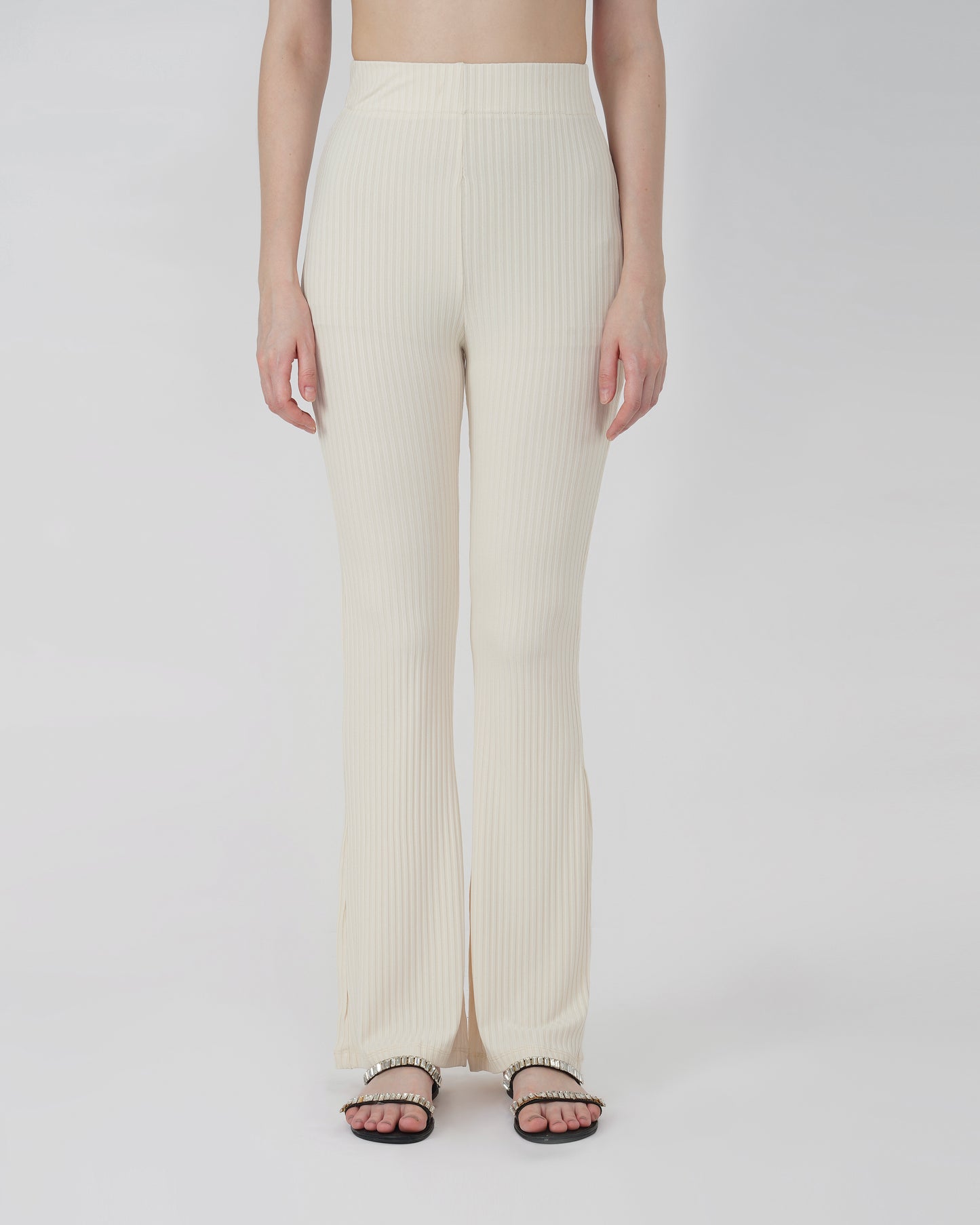 RIBBED FLARED TROUSER,Color: Cream
Fabric: Ribbed 
Fit: Flared Fit 
Length: Full Length (43 inches)
Waist: High Rise
Print: Solid
Details: Ribbed Surface,bottomwear,trousers,casual,knitted,ribbed,cream,flared fit,flared,full length,flared,high rise,suited for influencer,ribbed-flared-trouser-cream