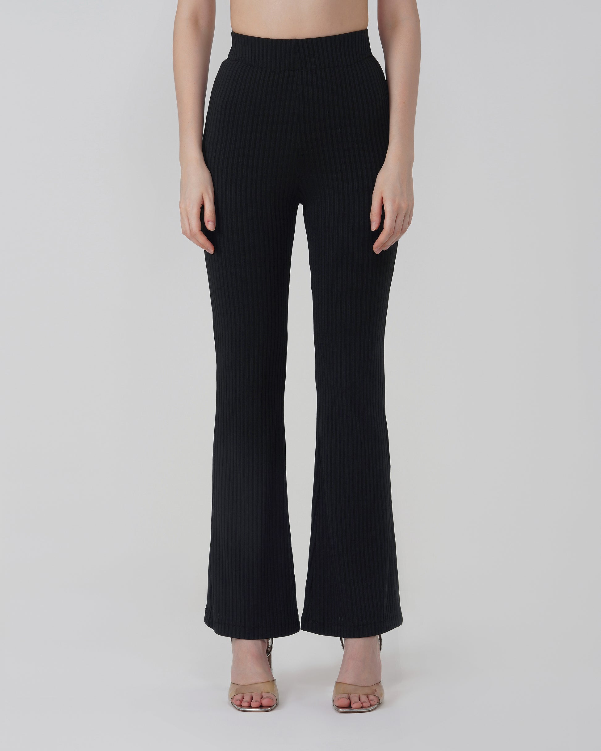 RIBBED FLARED TROUSER,Color: Black
Fabric: Ribbed
Fit: Flared Fit 
Length: Full Length (43 inches)
Waist: High Rise
Print: Solid
Details: Ribbed Surface,bottomwear,trousers,casual,knitted,ribbed,black,flared fit,flared,full length,flared,high rise,suited for influencer,ribbed-flared-trouser-black