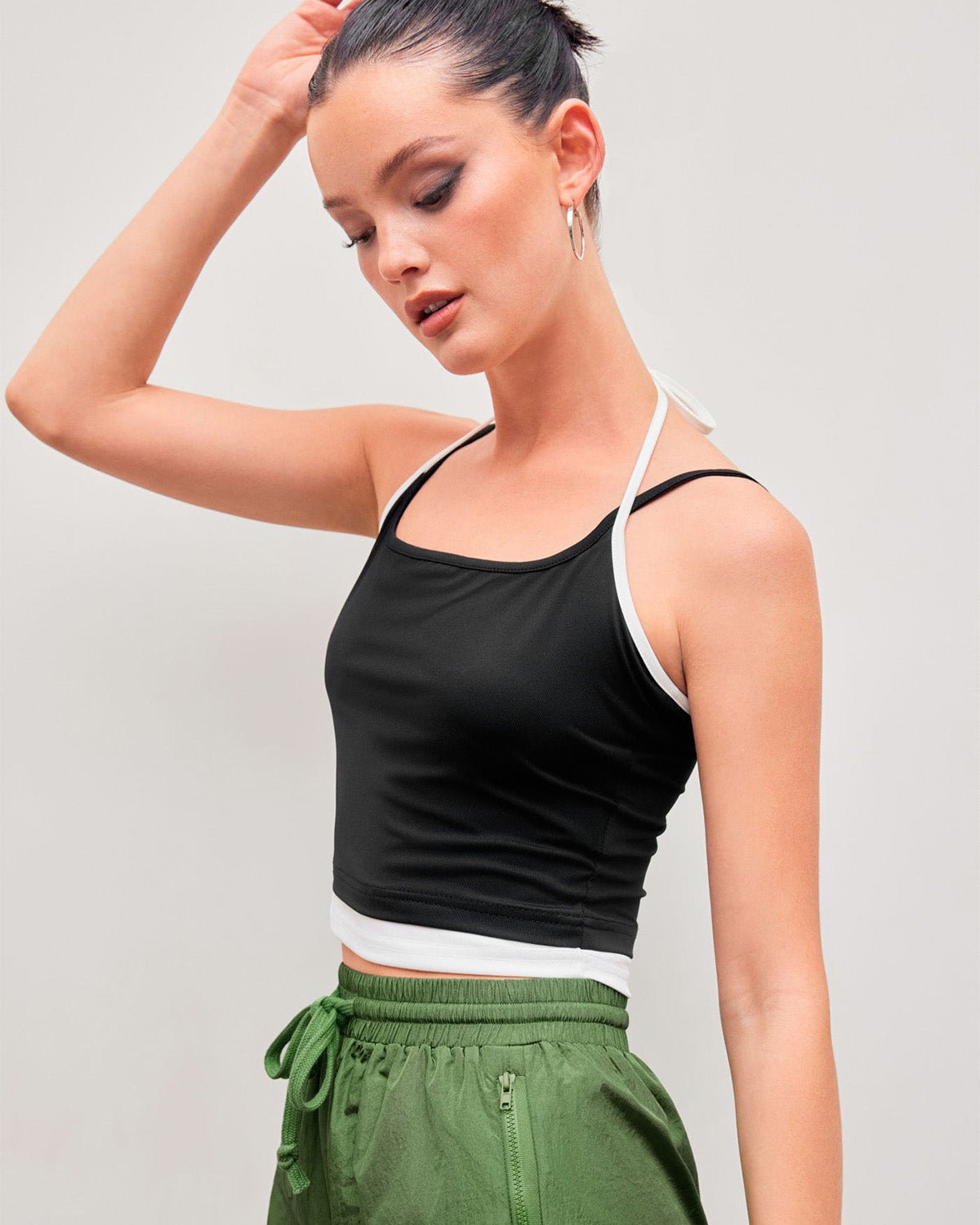 halter-neck-crop-top-black,HALTER NECK CROP TOP,topwear,tops,casual,streetwear,knitted, stretchable,single jersey,black,solid,contrast,skinny fit,crop,crop,halter neck,spaghetti strap,sleeveless