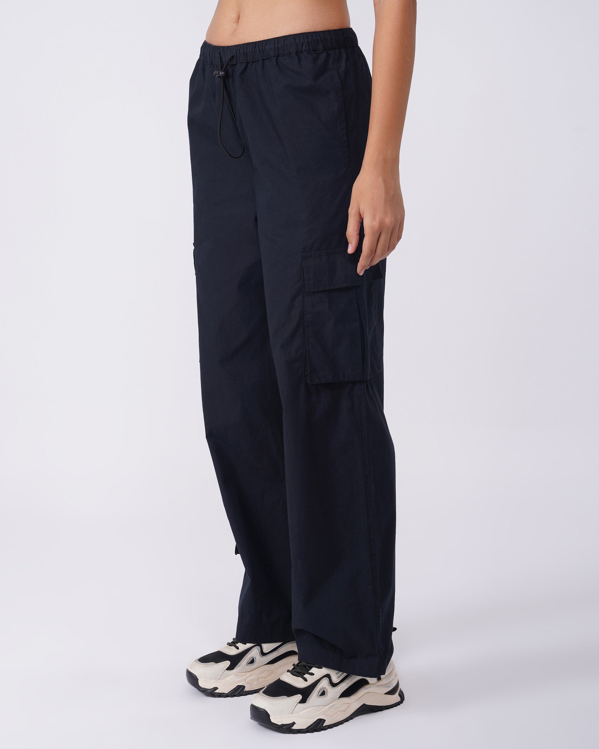 utility-pocket-parachute-pants-black,UTILITY-POCKET PARACHUTE PANTS,Color: BlackFabric: Cotton PoplinFit: Relaxed Fit Length: Full Length (39 in)Waist: Mid RiseClosure: Elasticated with drawstringNo. of Pockets: 5Print: SolidDetail: Flap pockets on sides,coord sets,parachutes,casual,streetwear,woven,cotton, poplin,black,flap pocket, utility pocket,relaxed fit,full length,drawstring,mid rise,Manufacturing batch1_June19