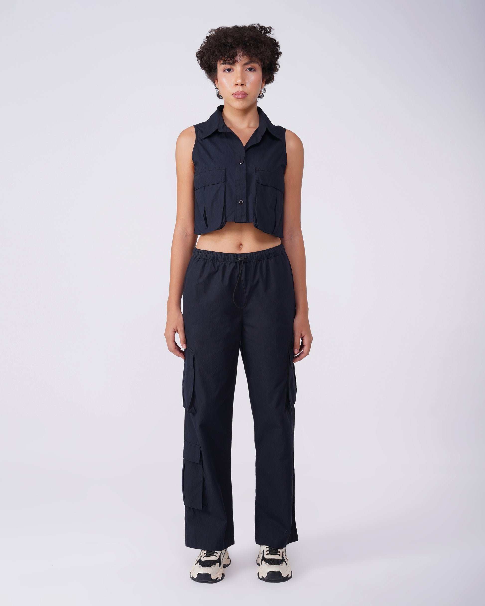 flap-pocket-co-ord-crop-shirt-black,FLAP POCKET CO-ORD CROP SHIRT,Color: BlackFabric: Cotton, PoplinFit: Regular Fit Length: CropNeck: CollaredSleeves: SleevelessClosure: Button-UpPrint: SolidDetails: Flap-Pocket,coord sets,tops,casual,streetwear,woven,cotton, poplin,black,solid,flap pocket, utility pocket,regular fit,crop,crop,collared,sleeveless,Manufacturing batch1_June19