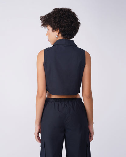 flap-pocket-co-ord-crop-shirt-black,FLAP POCKET CO-ORD CROP SHIRT,Color: BlackFabric: Cotton, PoplinFit: Regular Fit Length: CropNeck: CollaredSleeves: SleevelessClosure: Button-UpPrint: SolidDetails: Flap-Pocket,coord sets,tops,casual,streetwear,woven,cotton, poplin,black,solid,flap pocket, utility pocket,regular fit,crop,crop,collared,sleeveless,Manufacturing batch1_June19