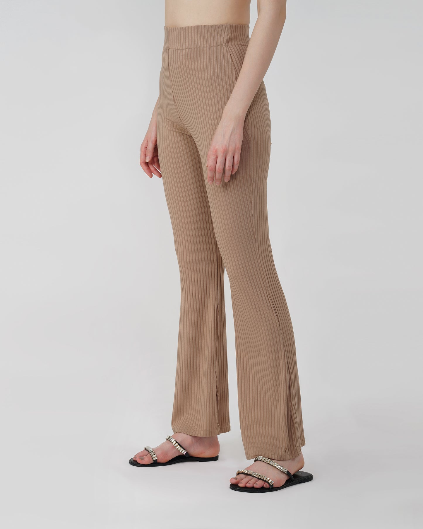 RIBBED FLARED TROUSER,Color: Nude
Fabric: Ribbed
Fit: Flared Fit 
Length: Full Length (43 inches)
Waist: High Rise
Print: Solid
Details: Ribbed Surface,bottomwear,trousers,casual,knitted,ribbed,nude,flared fit,flared,full length,flared,high rise,suited for influencer,ribbed-flared-trouser-nude