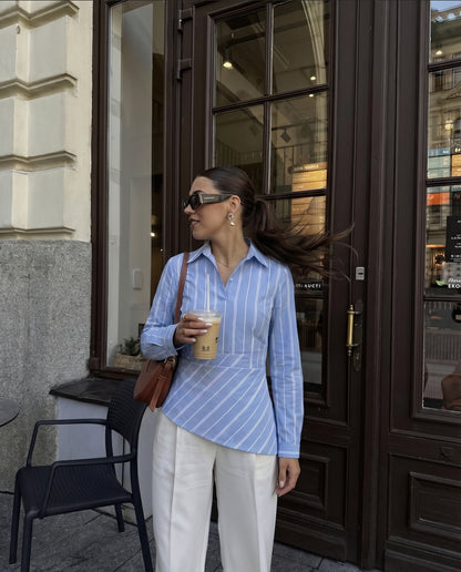 blue, asymmetrical shirt, summer, pastel blue, Stylish blue shirt, vertical stripes, playful, fun.
