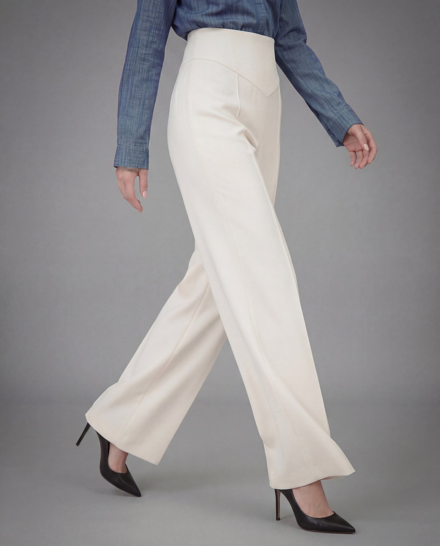 SCULPTED WAIST PLEATED TROUSERS,Color: White
Fabric: 95% poly 5% spandex
Fit: Tailored Fit
Length: Full Length(41")
Waist: High Rise 
Closure: Elasticated
No. of Pockets: 2
Print: Solid
Details: Corset shaped panel in front for a clinched waist look,pants,bottomwear,pants,semi-formal,business outfit,stretchable,polyester, spandex,white,pleated,tailored fit,wide leg,full length,high rise