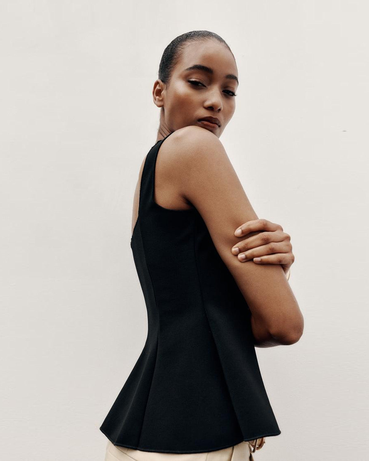 topwear,tops,semi-formal,statement piece,knitted,polyester, spandex,black,solid,panelling,button, golden trims,slim fit,vest,waist length,flounce hem,diamond neck,shoulder strap,no sleeves,sleeveless, OY2177, 25090044GG