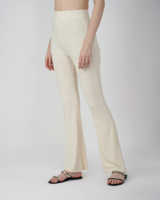 RIBBED FLARED TROUSER,Color: Cream
Fabric: Ribbed 
Fit: Flared Fit 
Length: Full Length (43 inches)
Waist: High Rise
Print: Solid
Details: Ribbed Surface,bottomwear,trousers,casual,knitted,ribbed,cream,flared fit,flared,full length,flared,high rise,suited for influencer,ribbed-flared-trouser-cream