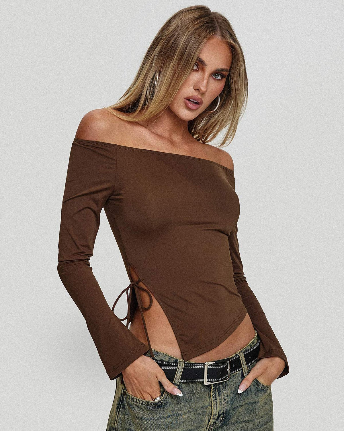 side-slit-off-shoulder-brown-top-brown-oy1508,25010008GG52,topwear,tops,vacation, outdoor events,bold, glam, streetwear,knitted,ribbed,brown,solid,slit,slim fit,fitted,regular,slit hem,off shoulder,long sleeves,Color: Brown
Fabric: Ribbed
Fit: Slim Fit 
Length: Regular
Neck: Off Shoulder
Sleeve: Long Sleeves
Print: Solid
Detail: Side slit with a drawstring tie knot,SIDE SLIT OFF SHOULDER BROWN TOP