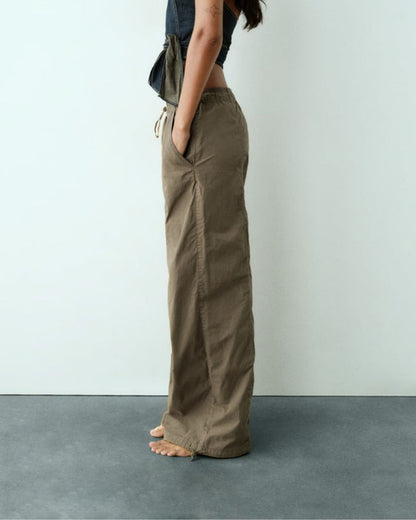 PARACHUTE PANTS,baggy fit, bottomwear, casual, cotton, drawstring, full length, mid rise, olive green, parachutes, streetwear, woven,parachute-pants-olivegreen,Color- Olive Green
Fabric- Cotton
Fit- Baggy Fit 
Length- Full Length (41in)
Waist- High Rise
Hem- Drawstring Hem
Closure- Elasticated waist
No. of Pockets- 2
Print- Solid