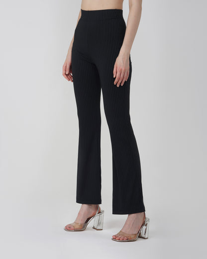 RIBBED FLARED TROUSER,Color: Black
Fabric: Ribbed
Fit: Flared Fit 
Length: Full Length (43 inches)
Waist: High Rise
Print: Solid
Details: Ribbed Surface,bottomwear,trousers,casual,knitted,ribbed,black,flared fit,flared,full length,flared,high rise,suited for influencer,ribbed-flared-trouser-black