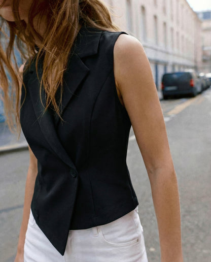 notch-collar-waist-coat-black,topwear,waist coat,semi-formal,creative workwear,woven,lycra, polyester,black,solid,tailored fit,regular,lapel collar,sleeveless,Color: Black
Fabric: Polyester, Lycra
Fit: Skinny Fit 
Length: Regular
Neck: Lapel Collar
Closure: Button
Print: Solid,NOTCH COLLAR WAIST COAT