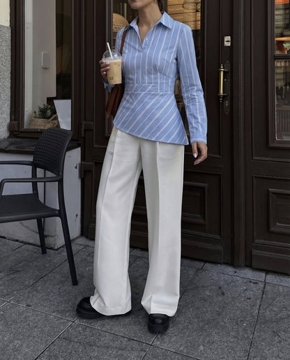 blue, asymmetrical shirt, summer, pastel blue, Stylish blue shirt, vertical stripes, playful, fun.