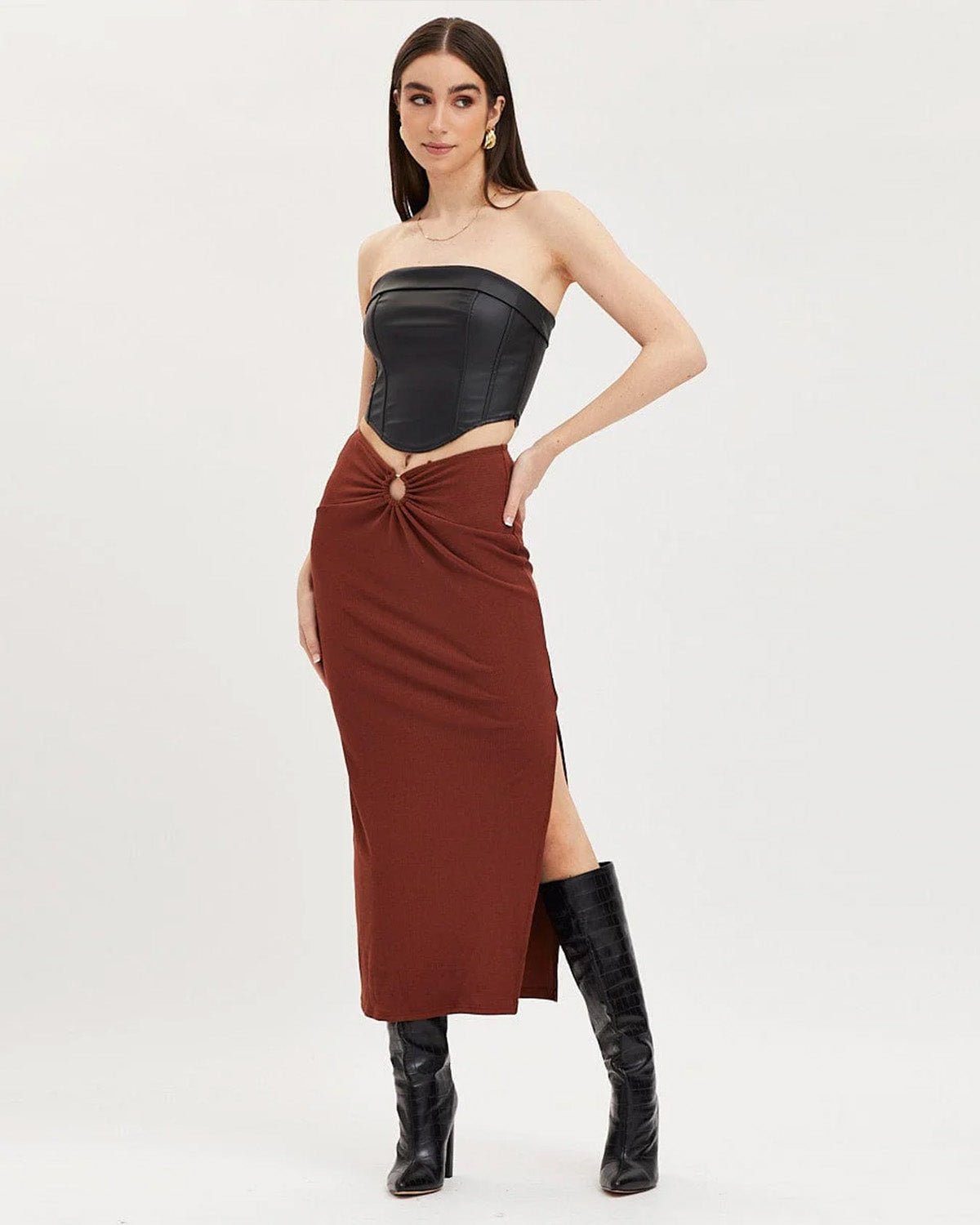 ribbed-slit-ring-detail-slit-skirt-brown-oy1514,25010014GG72,bottomwear,skirts,party,glam, streetwear,knitted,ribbed,brown,skinny fit,slit,midi,mid rise,Color: Brown
Fabric: Ribbed
Fit: Slim Fit
Type: Slit Skirt
Length: Midi
Waist: Mid Rise
Closure: Elasticated
Print: Solid
Detail: Ring in the centre front gives a snatched waist look.,RIBBED SLIT RING DETAIL SLIT SKIRT