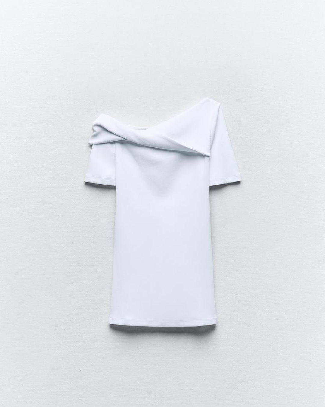RUCHED ASYMMETRICAL TOP,bodycon, casual, cotton, knitted, one shoulder, regular, short sleeves, skinny fit, solid, spandex, stretchable, summer, tops, topwear, twisted, twisted neck, white,ruched-asymmetrical-top-white,Color- White
Fabric- 96% Cotton 5% Spandex 
Type- Assymetrical Top
Fit- Skinny Fit
Length- Regular
Neck- Twisted Neck
Sleeves- Short Sleeves
Details- One Shoulder