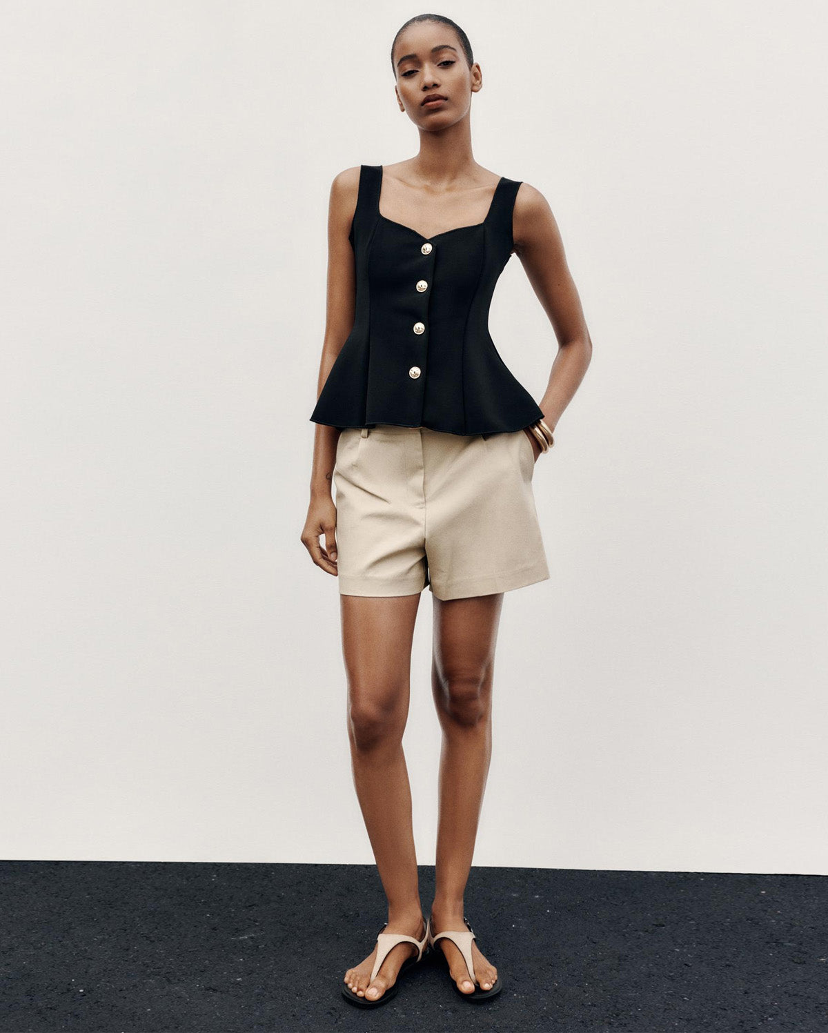 topwear,tops,semi-formal,statement piece,knitted,polyester, spandex,black,solid,panelling,button, golden trims,slim fit,vest,waist length,flounce hem,diamond neck,shoulder strap,no sleeves,sleeveless, OY2177, 25090044GG