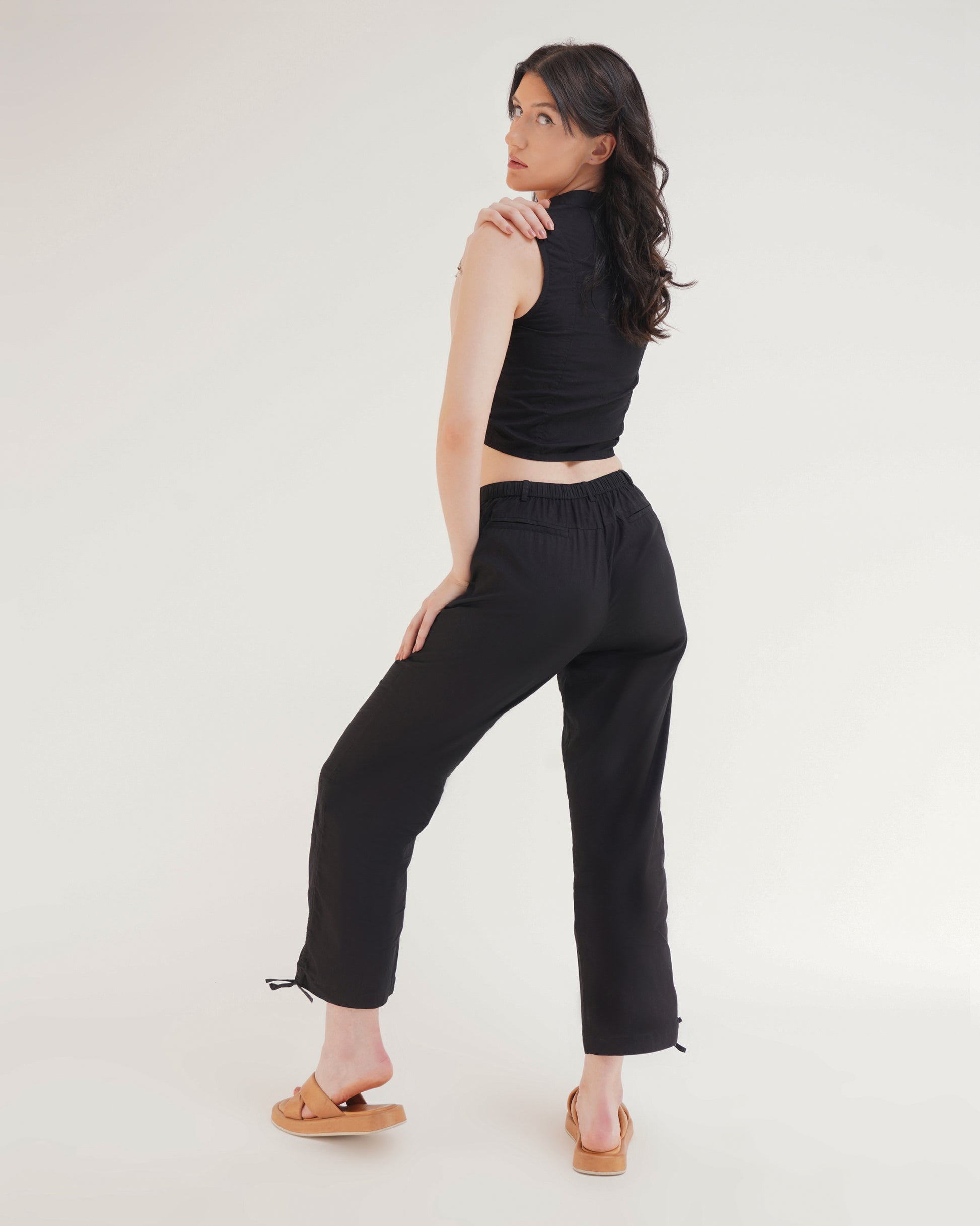 RUCHED COORD SET - TROUSERS,ankle length, black, bottomwear, casual, coord sets, cotton, drawstring, high rise, pants, relaxed fit, ruched, streetwear, summer, wide leg, woven,wide-leg-ruched-pants-black,Color- BlackFabric- CottonType- Wide LegFit- Relaxed Fit Length- Ankle LengthWaist- High RiseClosure- Zip &amp; ButtonNo. of Pockets- 2Detail- Drawstring Hem
Contains only Pants