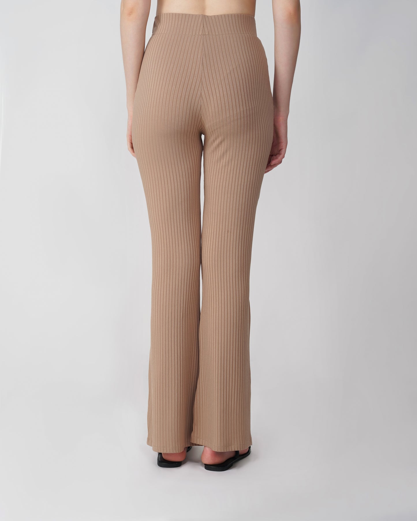 RIBBED FLARED TROUSER,Color: Nude
Fabric: Ribbed
Fit: Flared Fit 
Length: Full Length (43 inches)
Waist: High Rise
Print: Solid
Details: Ribbed Surface,bottomwear,trousers,casual,knitted,ribbed,nude,flared fit,flared,full length,flared,high rise,suited for influencer,ribbed-flared-trouser-nude