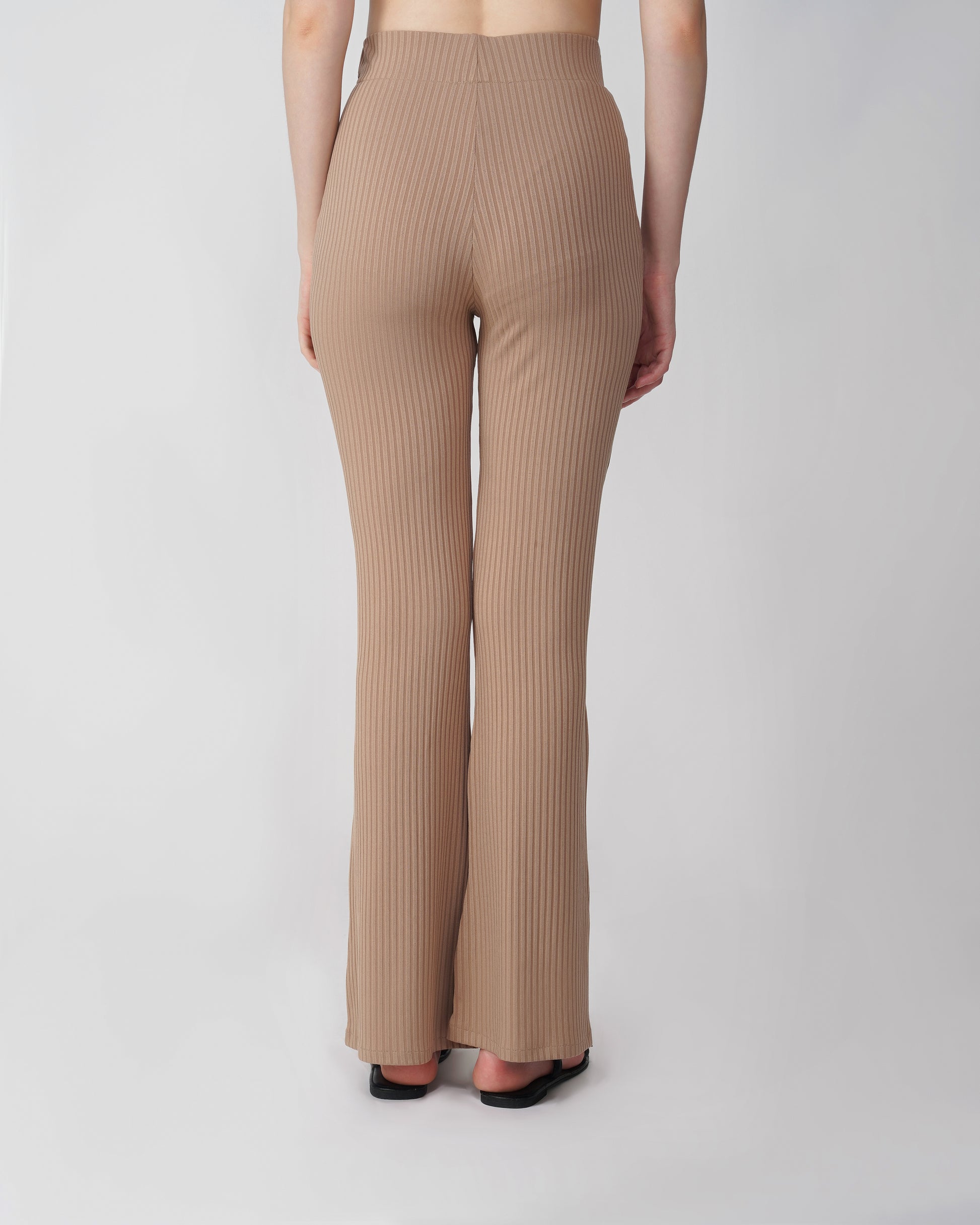 RIBBED FLARED TROUSER,Color: Nude
Fabric: Ribbed
Fit: Flared Fit 
Length: Full Length (43 inches)
Waist: High Rise
Print: Solid
Details: Ribbed Surface,bottomwear,trousers,casual,knitted,ribbed,nude,flared fit,flared,full length,flared,high rise,suited for influencer,ribbed-flared-trouser-nude