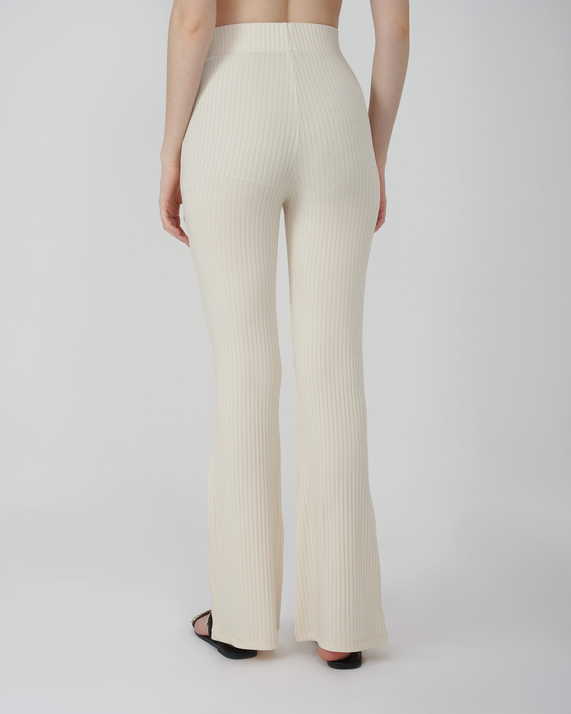 RIBBED FLARED TROUSER,Color: Cream
Fabric: Ribbed 
Fit: Flared Fit 
Length: Full Length (43 inches)
Waist: High Rise
Print: Solid
Details: Ribbed Surface,bottomwear,trousers,casual,knitted,ribbed,cream,flared fit,flared,full length,flared,high rise,suited for influencer,ribbed-flared-trouser-cream