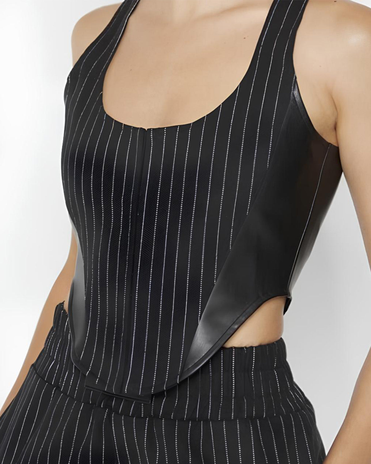 pinstripes-corset-top-black-oy1029,24110005GG52,topwear,tops,casual,bold, glam, streetwear,woven,polycotton,black,pinstripes,tailored fit,corset,regular,curved hem,scoop neck,shoulder strap,sleeveless,Color: Black
Fabric: Poly Cotton 
Fit: Tailored Fit 
Length: Regular
Neck: Scoop Neck
Print: Pinstripes
Closure: Hook & Eye
Details: The curved hem adds a modern edge to the top while accentuating the waist.,PINSTRIPES CORSET TOP