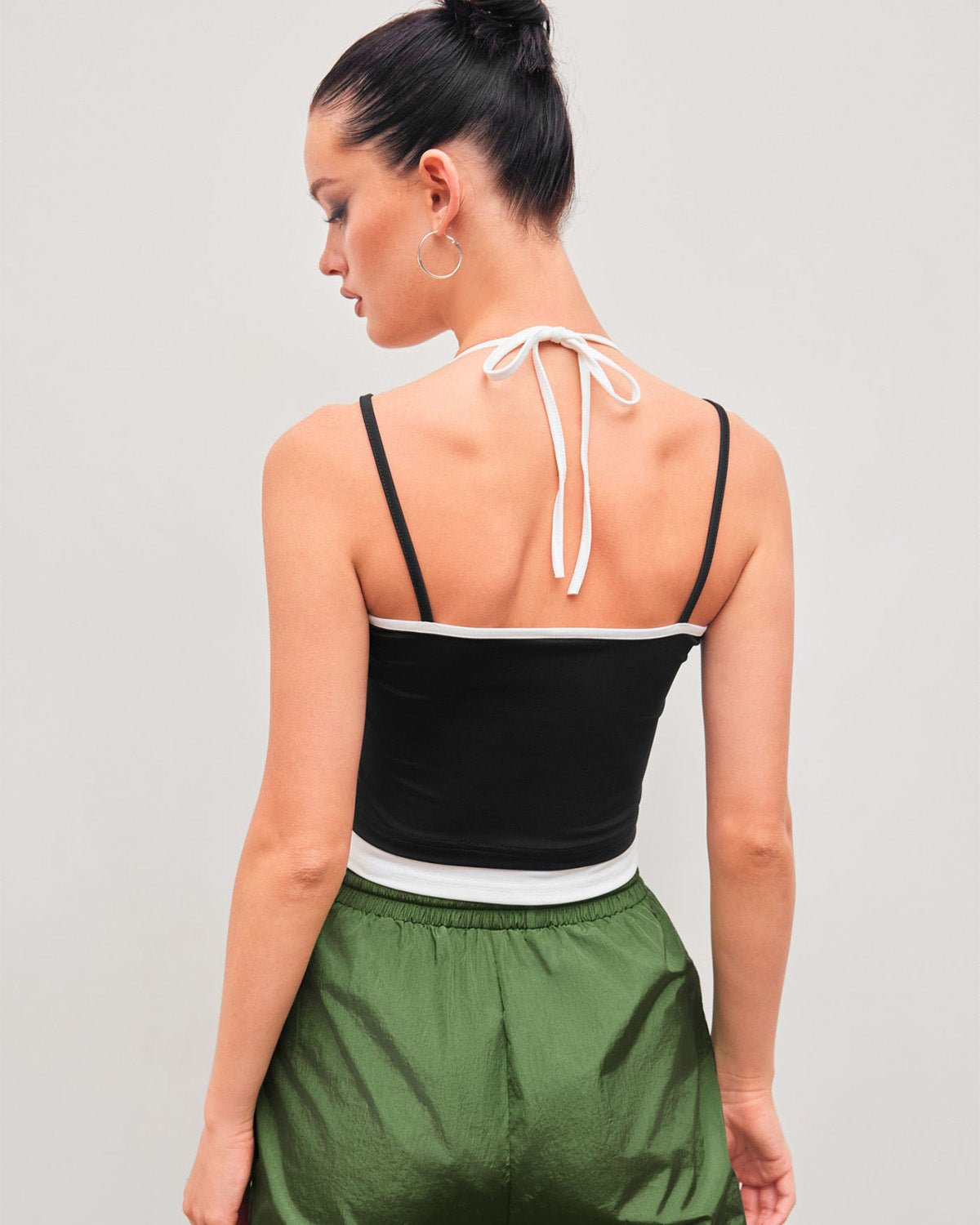halter-neck-crop-top-black,HALTER NECK CROP TOP,topwear,tops,casual,streetwear,knitted, stretchable,single jersey,black,solid,contrast,skinny fit,crop,crop,halter neck,spaghetti strap,sleeveless