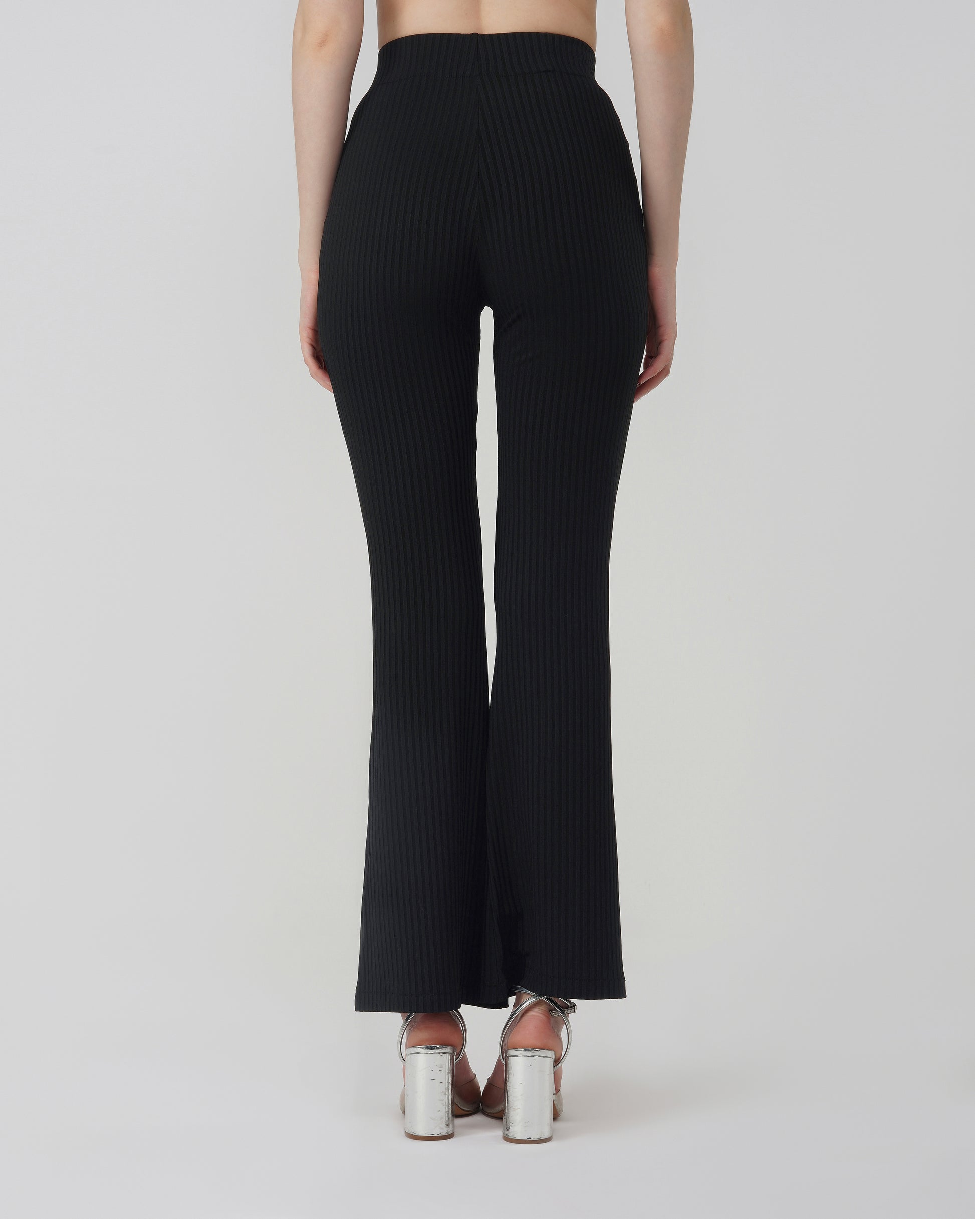 RIBBED FLARED TROUSER,Color: Black
Fabric: Ribbed
Fit: Flared Fit 
Length: Full Length (43 inches)
Waist: High Rise
Print: Solid
Details: Ribbed Surface,bottomwear,trousers,casual,knitted,ribbed,black,flared fit,flared,full length,flared,high rise,suited for influencer,ribbed-flared-trouser-black