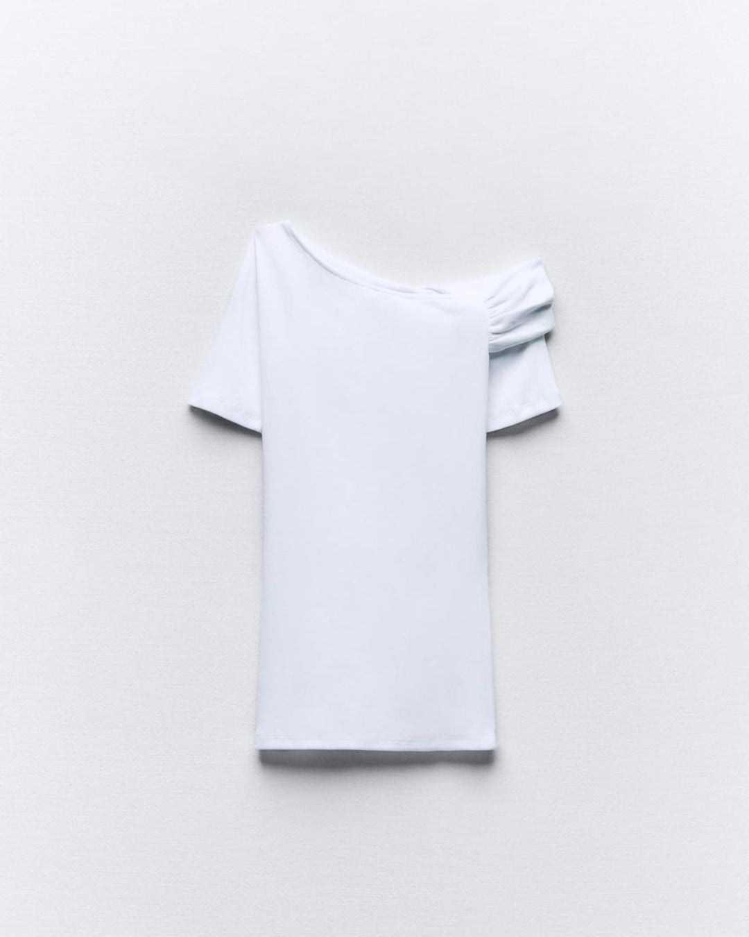RUCHED ASYMMETRICAL TOP,bodycon, casual, cotton, knitted, one shoulder, regular, short sleeves, skinny fit, solid, spandex, stretchable, summer, tops, topwear, twisted, twisted neck, white,ruched-asymmetrical-top-white,Color- White
Fabric- 96% Cotton 5% Spandex 
Type- Assymetrical Top
Fit- Skinny Fit
Length- Regular
Neck- Twisted Neck
Sleeves- Short Sleeves
Details- One Shoulder