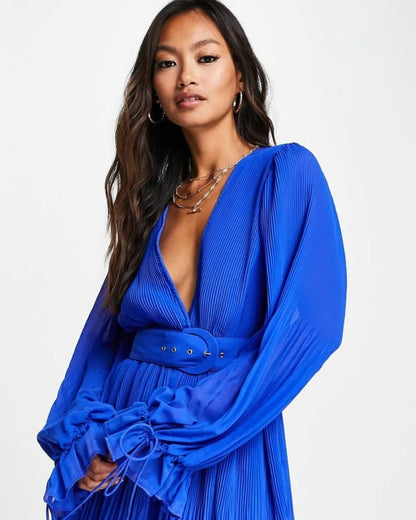 pleated-mini-dress-blue,PLEATED MINI DRESS,Color: Blue
Fabric: Georgette
Type: A-Line
Fit: Regular Fit
Length: Mini
Neck: Plunge Neckline
Sleeve: Bishop Sleeve
Closure: Button
Trims: Belt
Print: Solid
Details: Pleated Fabric,dresses,dresses,vacation,glam,woven,georgette,blue,solid,pleated,belt,regular fit,a line,mini,plunge neckline,bishop sleeves,long sleeves,deep back