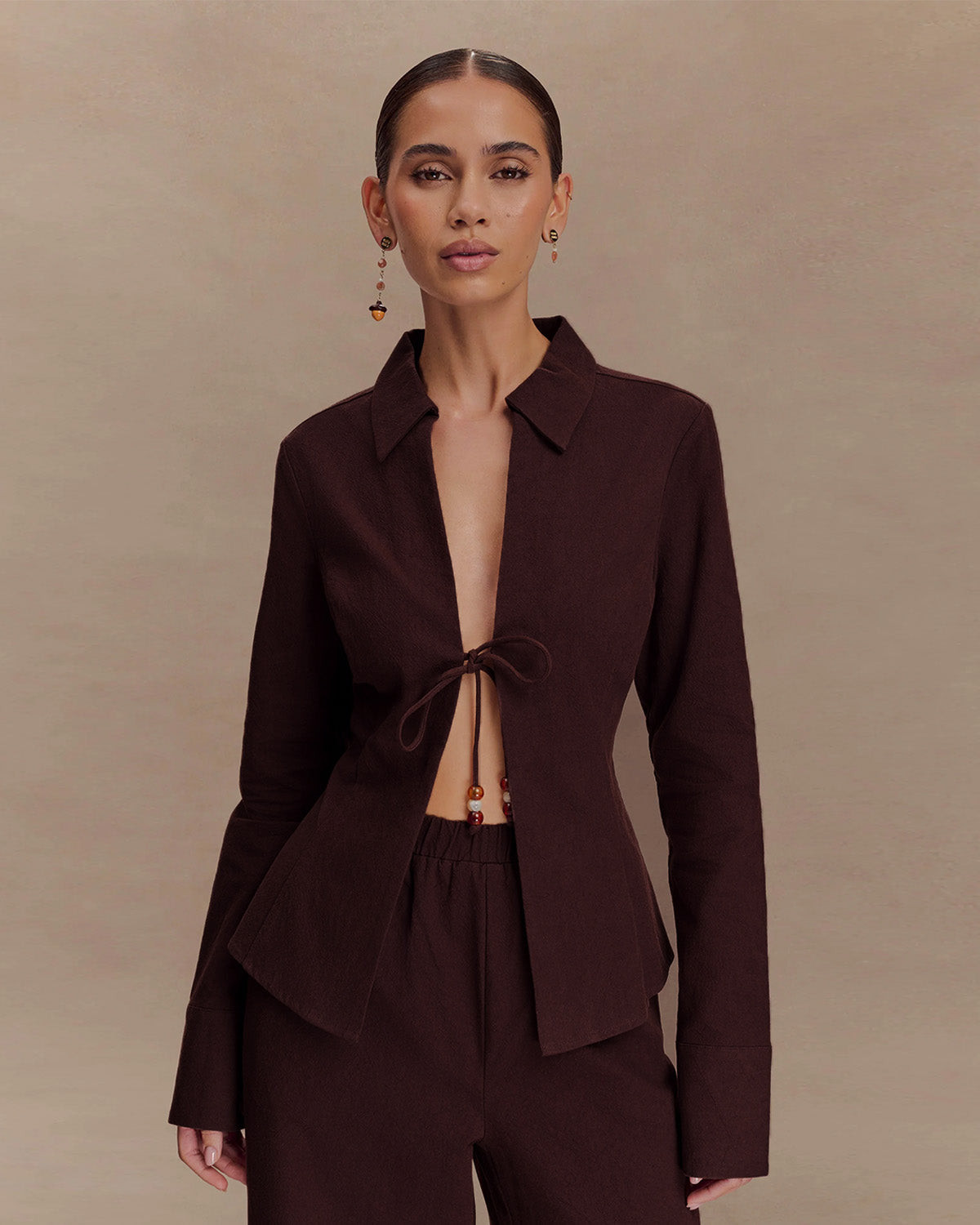 coord sets,bottomwear, topwear,casual chic, outddoors, vacation, lunch date, summer,urban fit, genz, minimal,woven,cotton,,,dark brown,solid,,,beads,regular fit top,front slit top,longline top,straight hem,lapel collar,no straps,long sleeves,full sleeves,tie up top,pants,wide leg pants,full length,straight hem,mid rise waist,side pockets, OY3052, 25070023GG